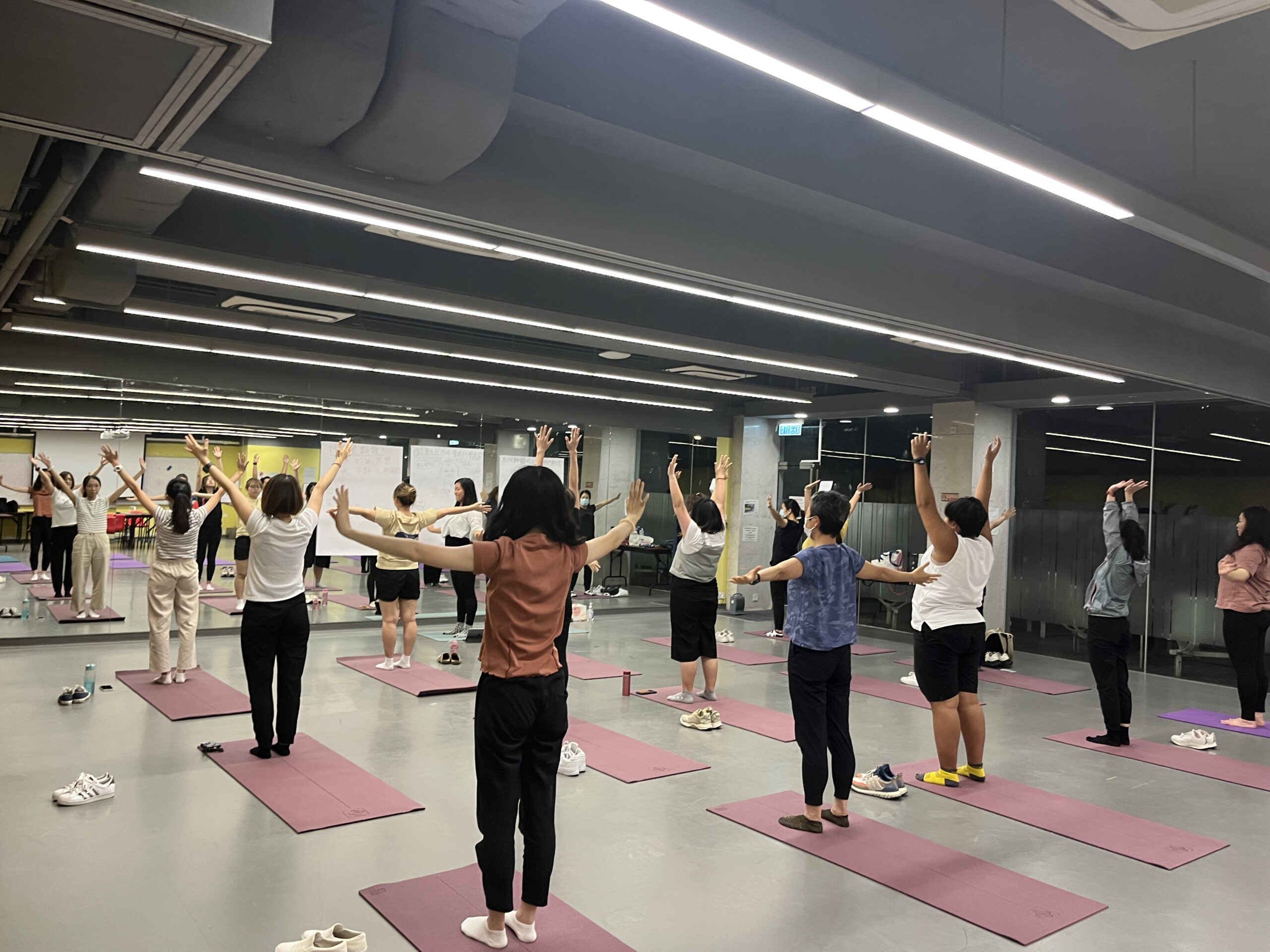 Participants of the Inclusive Mindfulness Yoga Workshop are practicing different yoga moves under the instruction of the instructor.